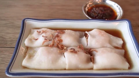 Steamed rice rolls filled with prawn on a clean white plate Stock-Footage 326641859