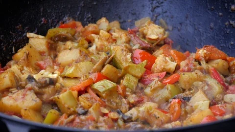 Steamed vegetables, bright multi-colored vegetable stew close-up. Steam Stock Footage 119964944