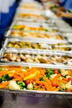 Steamed vegetables in professional warm catering, diversity of food Stock Photos