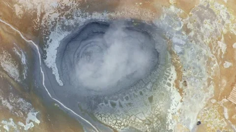 Steaming and bubbling mud pool with steam in hverir, Iceland, dolly out Stock Footage 138737711