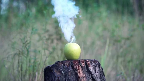 Steaming apple in smoke Stock Footage 136203714