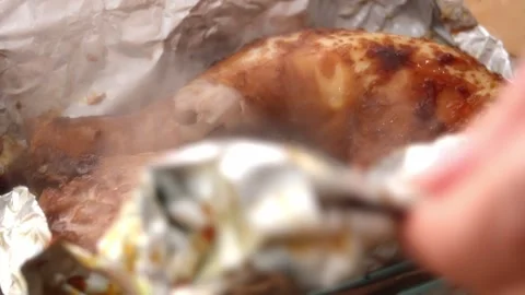 Steaming Barbecued Chicken in Foil Stock Footage 255664676