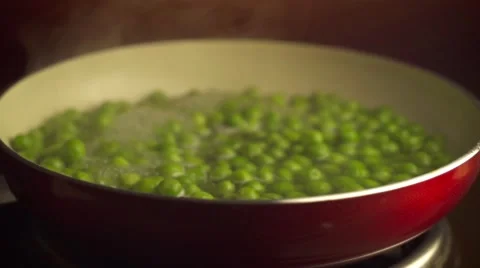 Steaming boiled green peas Stock Footage 57317605