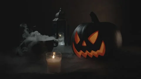 Steaming Boiling Cauldron with Lid Aside and Jack-O-Lantern in Fog | Slow-Mo Stock Footage 138332731