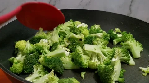 Steaming Broccoli Florets with Little Amount of Water in a Pan Stock Footage 234882897