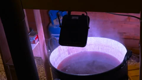Steaming cauldron boiling mysterious liquid potion Stockbeeldmateriaal 333268340