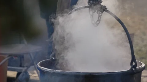 Steaming cauldron outside close up 動画素材 121074244