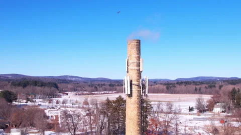 Steaming Chimney Winter Landscape Daytime - Aerial Tracking 库存影片 170592148