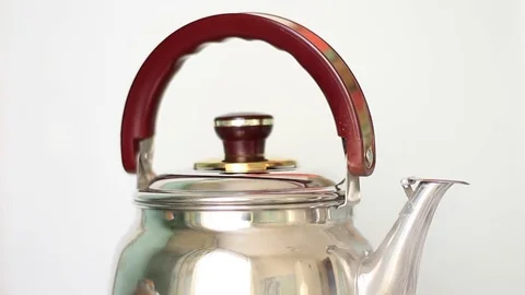Steaming chrome-plated teapot on a gas stove 스톡 동영상 71951789
