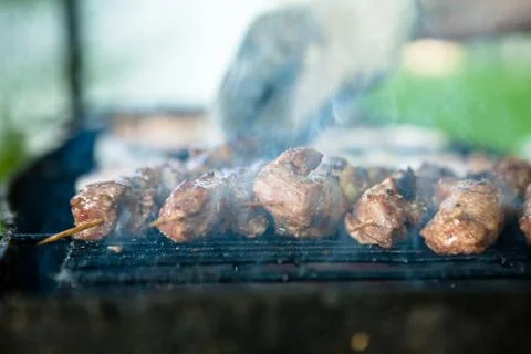 A steaming Cloud of smoke emanating from a hot juicy piece of meat lying on a Foto stock