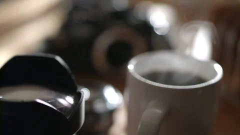 Steaming Coffee with Camera's in Background 스톡 동영상 93104437
