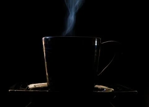 Steaming coffee in a cup Stock Photos