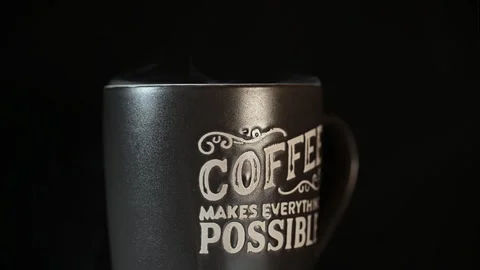 Steaming Coffee Mug with Inspirational Typography on Black Background Vidéo 337119909