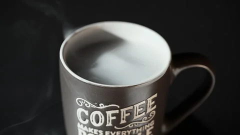 Steaming Coffee Mug with Inspirational Typography on Black Background Stock Footage 341960122