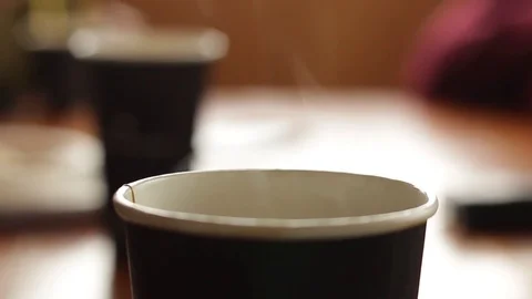 Steaming Coffee Take Away Cup DOF Video stock 74535729