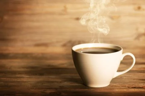 Steaming coffee in white mug Stock Photos
