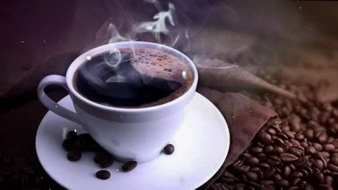 Steaming Cup of Coffee with Coffee Beans on Dark Brown Background Vídeo Stock 343698323