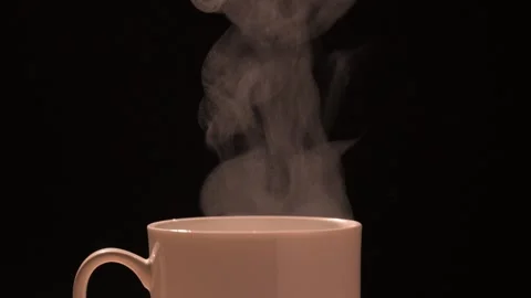 Steaming Cup of Coffee warm light black background Stock Footage 294561661