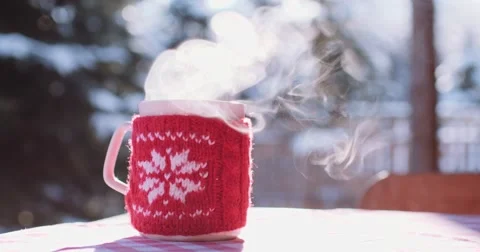Steaming Cup of Hot Drink in Snowy Winter Morning. 4K DCi SLOW MOTION 120 fps. Stock Footage 67217831