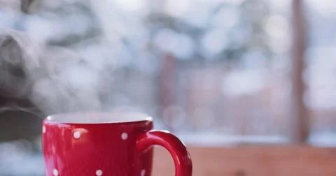 Steaming Cup of Hot Drink in Snowy Winter Morning. 4K DCi SLOW MOTION 120 fps. Stock Footage 67217927