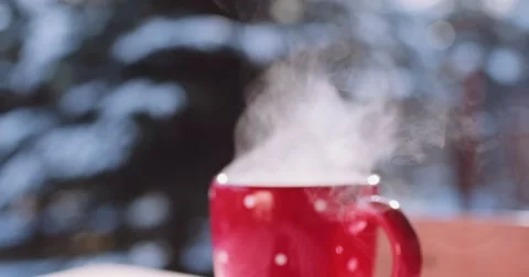 Steaming Cup of Hot Drink in Snowy Winter Morning. 4K DCi SLOW MOTION 120 fps. Stock Footage 67218031