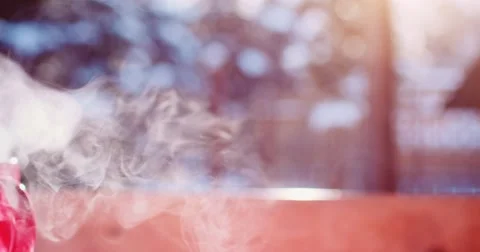 Steaming Cup of Hot Drink in Snowy Winter Morning. 4K DCi SLOW MOTION 120 fps. Stock Footage 68827262