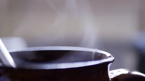 Steaming cup of hot tea closeup Stock Footage 99728887