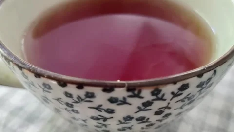Steaming cup of tea on dining table Stock Footage 341615425