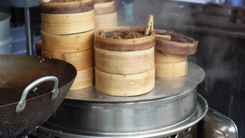 Steaming dim sum bamboo container tier stack Chinese cantonese famous food Stock-Footage 153750841