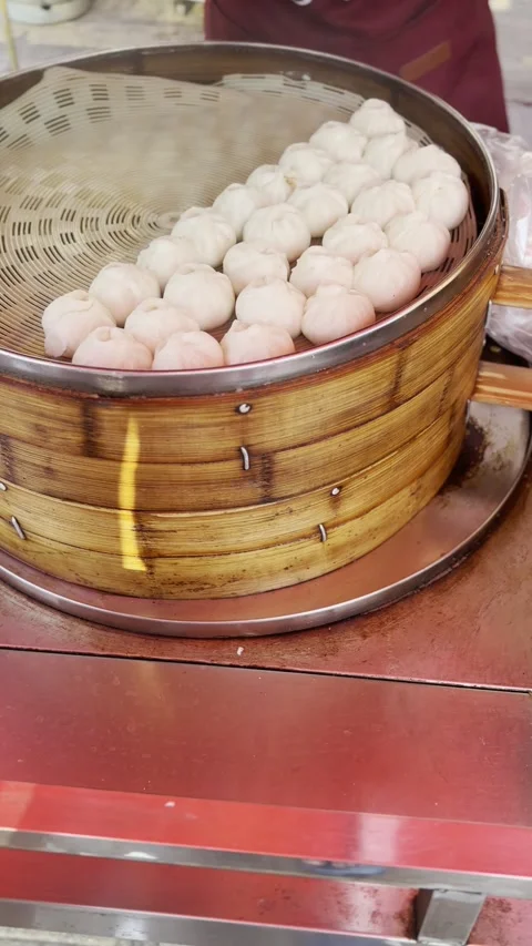 Steaming Dumplings in Bamboo Basket Stock Footage 343877352