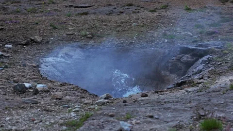 Steaming geothermal hot spring pool in Iceland barren landscape Stock Footage 341295562