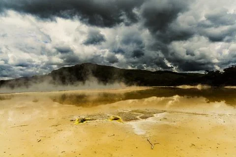 Steaming Geothermal Lake Under Dramatic Storm Clouds Stock-Fotos