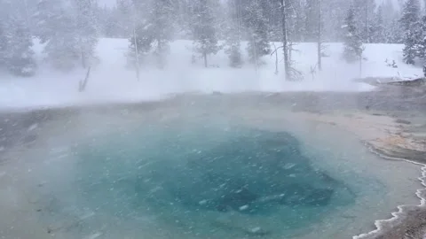 Steaming Geothermal Pool during snow at Yellowstone National Park Stock Footage 169208189