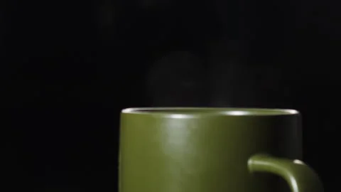 Steaming Green Mug on Dark Background Stock Footage 276836157