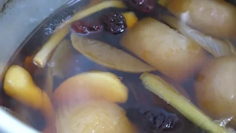 Steaming Herbal Broth and Aromatics Simmering in a Large Pot Video stock 343587966