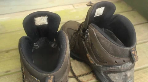 Steaming hiking boots after long day of walking Stock Footage 50483388