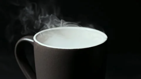 Steaming Hot Beverage in a Ceramic Mug Against a Dark Background Stock-Footage 337119901