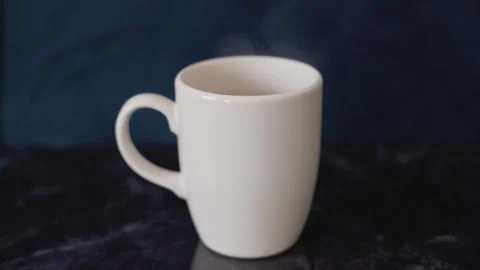 Steaming Hot Beverage in a Cozy Setting Stock Footage 302581537