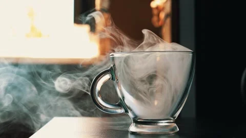 Steaming Hot Coffee Cup on Table in Cozy Interior Stock Footage 345144601