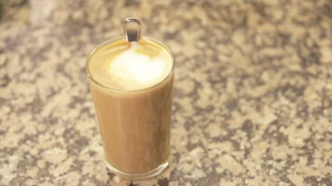 Steaming hot latte coffee with heart art Stock-Footage 331066832