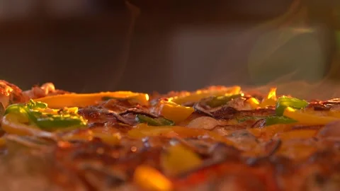 Steaming Hot Pizza On The Table With Sunset Hue In The Background Stock Footage 227185260