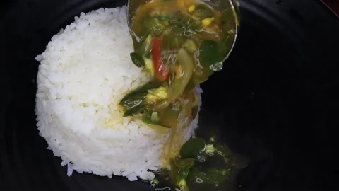 Steaming Hot Rice Served with Spinach Sambar – Traditional South Indian Meal Stock Footage 314411300