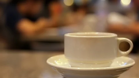 Steaming hot tea or coffee in a cup. Waiting someone in a restaurant. Stock Footage 92933709