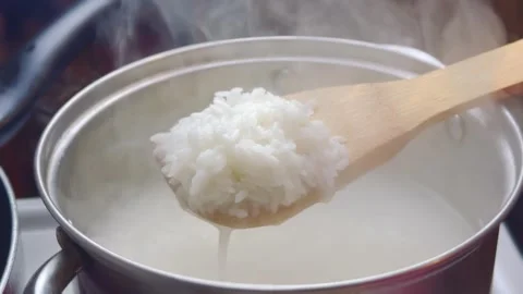 Steaming hot white rice served in a bowl Video stock 334678108