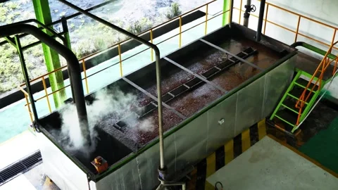 Steaming industrial processing tank in modern factory, high angle view Stock-Footage 337440345