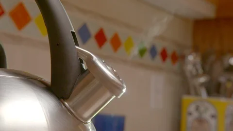 Steaming kettle on a kitchen stove Stock Footage 95144057