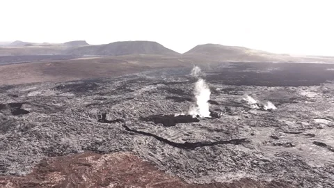 Steaming lava vents crack open vast volcanic plain in iceland Stock Footage 313576061