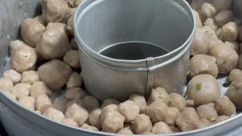 Steaming meatballs or pentol inside a large metal steamer pot 스톡 동영상 329613145