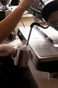 Steaming milk for coffee. Close-up. Stock Photos