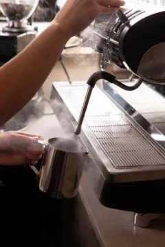 Steaming milk for coffee. Close-up. Stock Photos
